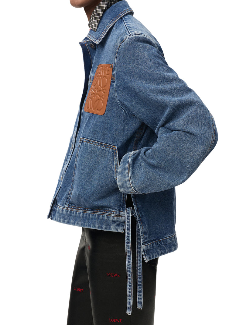 COTTON DENIM JACKET WITH AN ASYMMETRIC HEM AND SIDE LACES