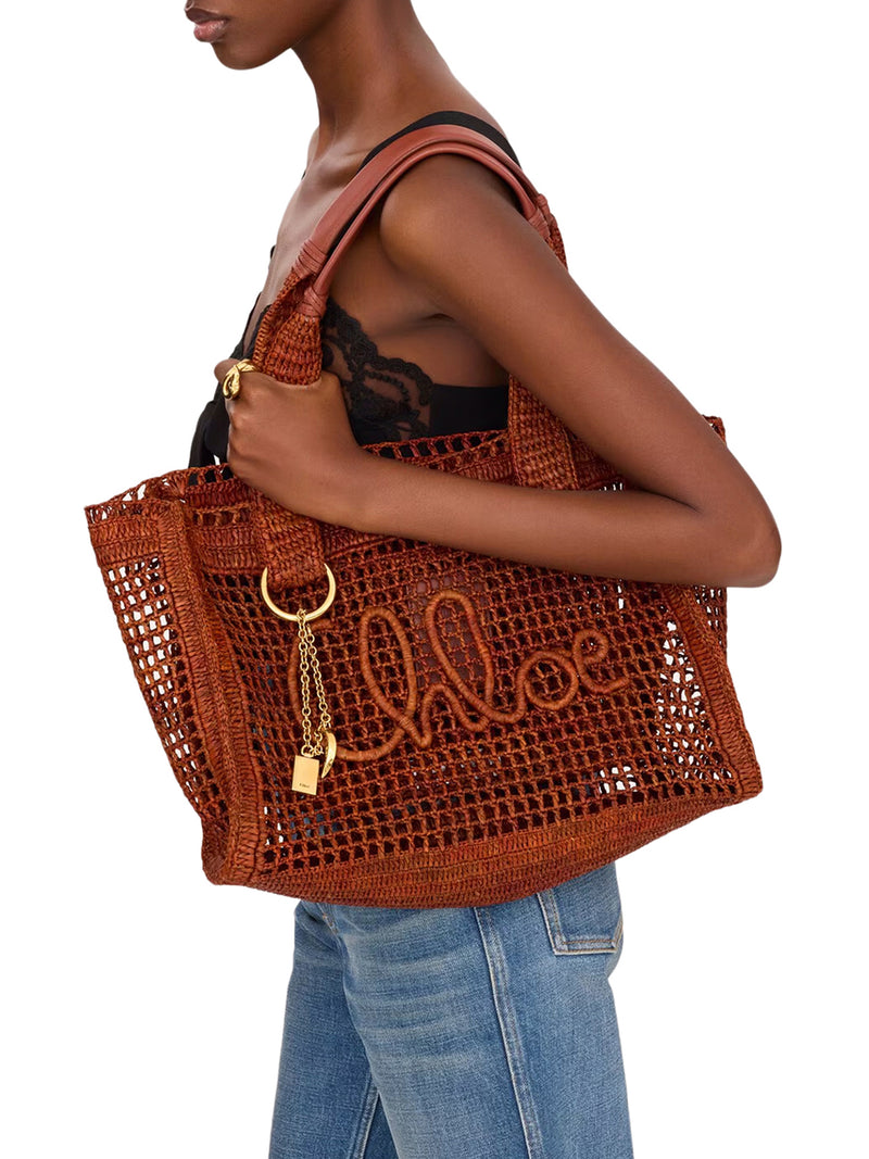 EAST-WEST SUMMER BANANA TOTE BAG IN RAFFIA