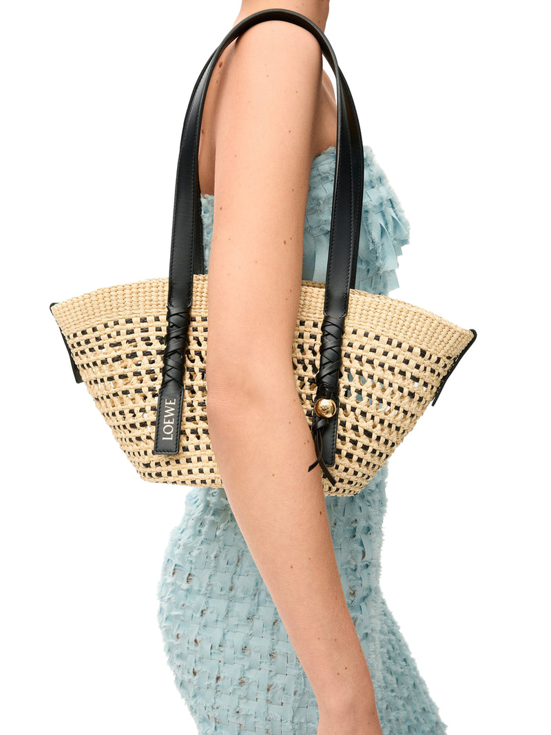 SMALL WOVEN BASKET MADE OF IRACA PALM AND CALFSKIN