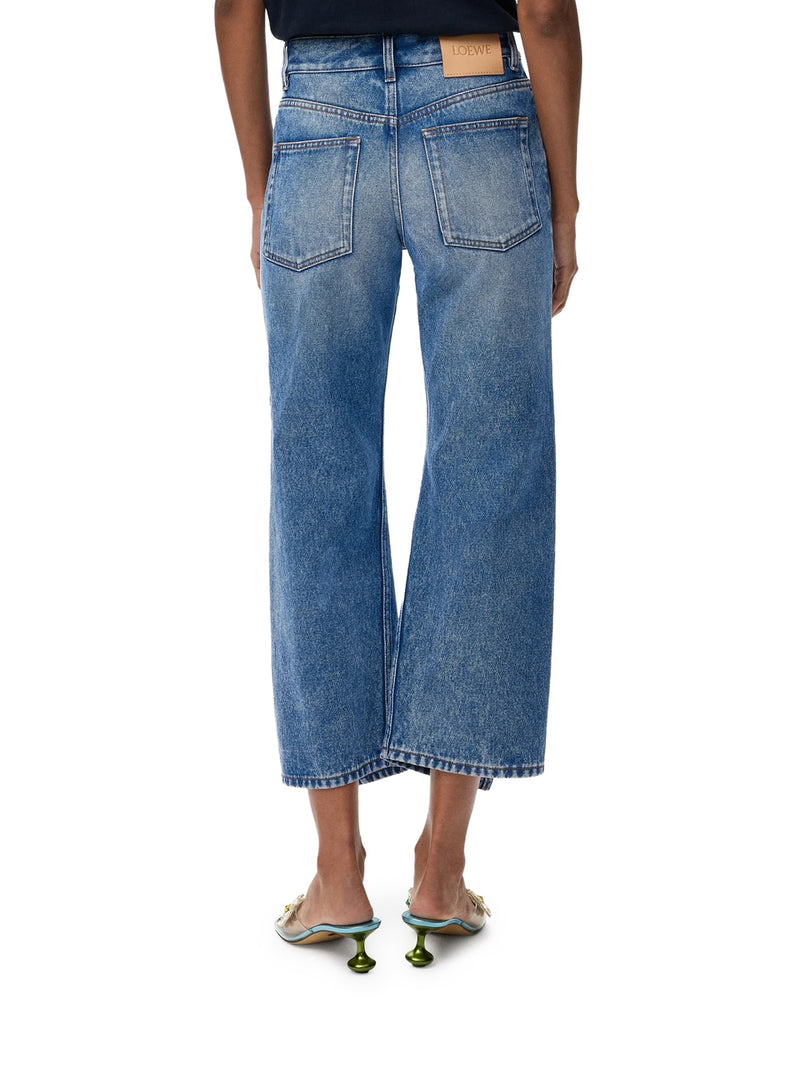 DENIM TROUSERS WITH FLARED LEG AND SIDE SLITS