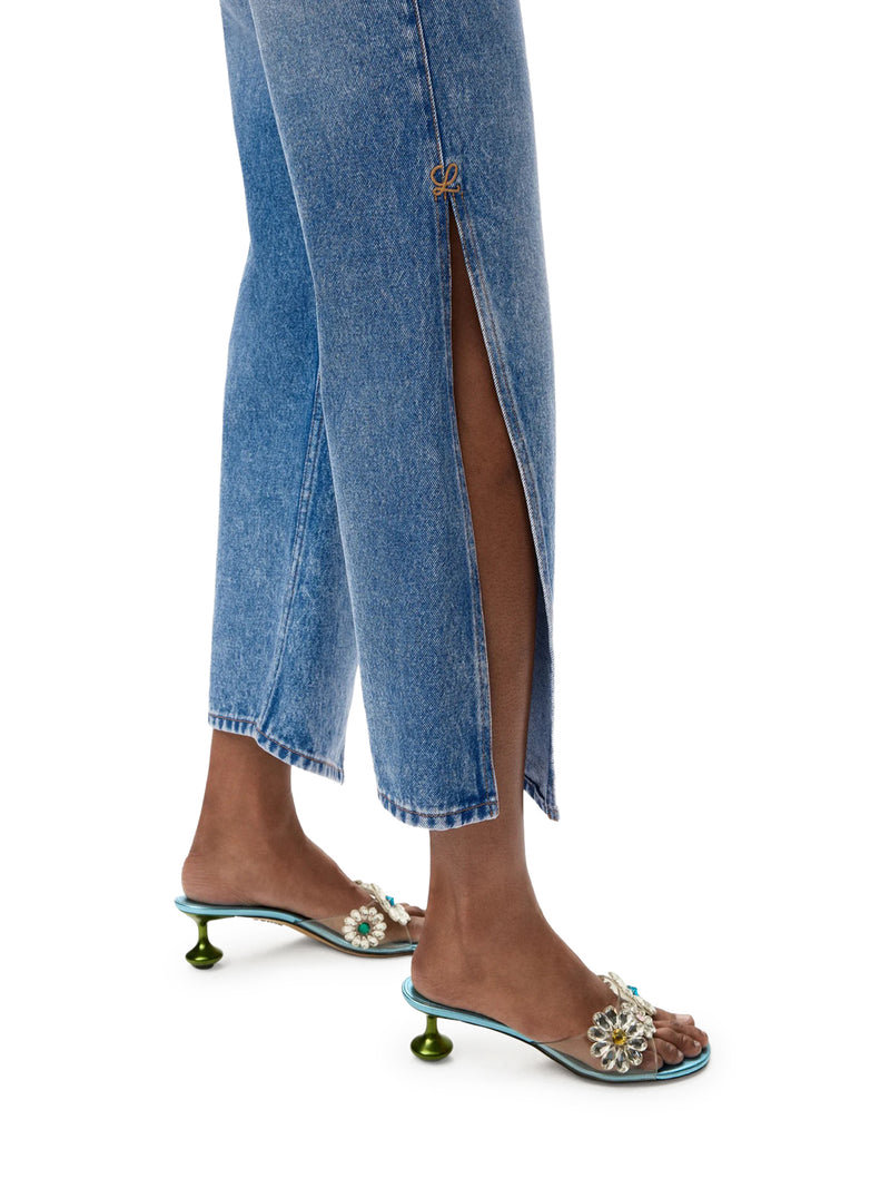 DENIM TROUSERS WITH FLARED LEG AND SIDE SLITS