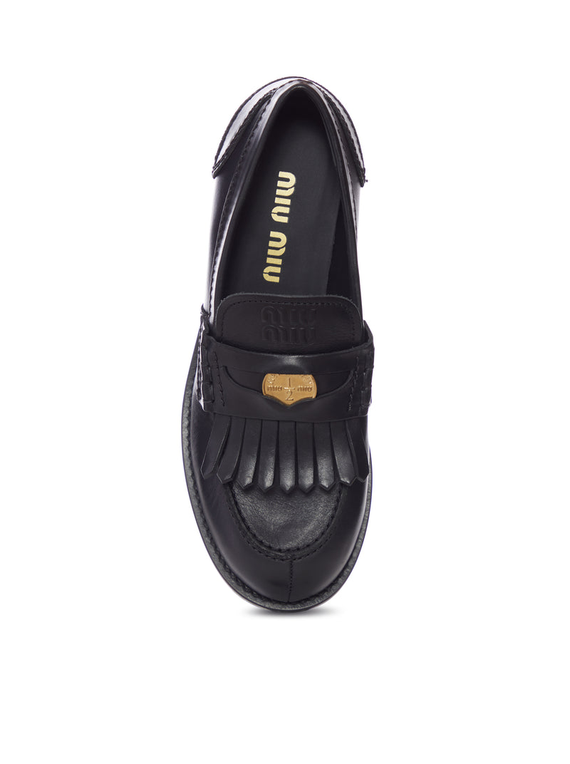 LEATHER MOCCASIN WITH FRINGES AND LOGO DETAIL
