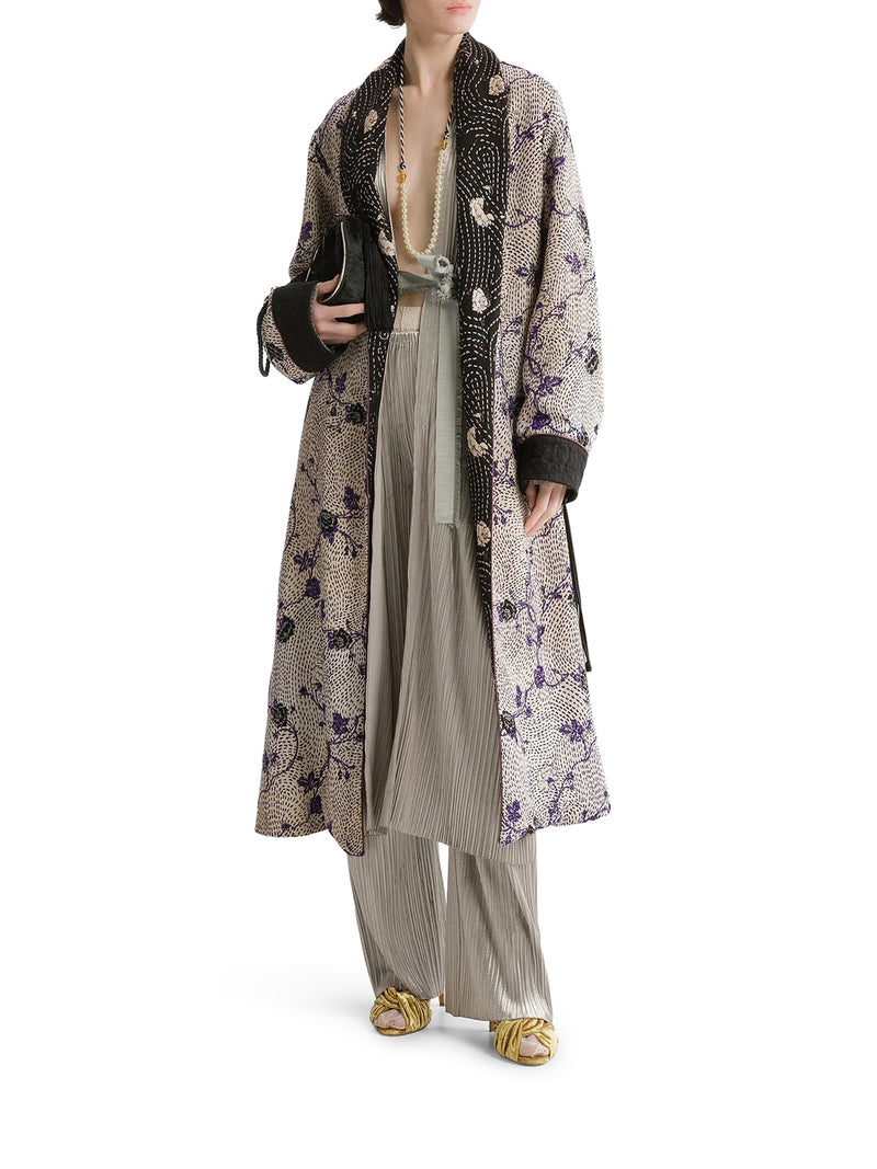 TROUSERS WITH AN ELASTICATED WAIST AND IRREGULAR PLEATING