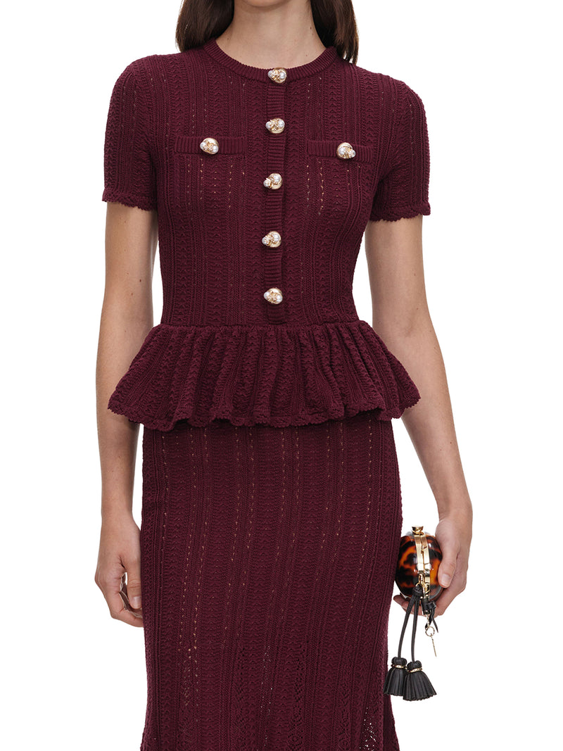 LONG DRESS IN OPENWORK KNIT WITH PEPLUM AND JEWEL BUTTONS